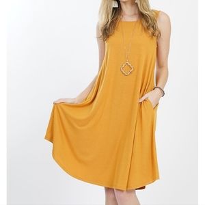 Zenana premium size small sleeveless flowing tank dress with pockets.